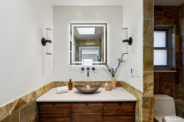 11 Perego Ter Unit 6, San Francisco, CA 94131 - bathroom with vanity, tile walls, and toilet