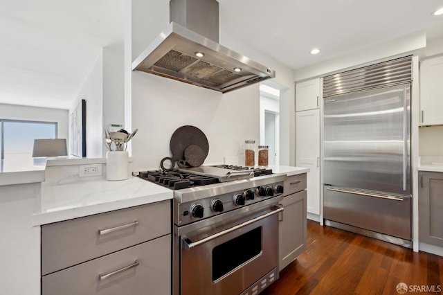 11 Perego Ter Unit 6, San Francisco, CA 94131 - kitchen with premium appliances, wall chimney range hood, gray cabinets, dark wood-style floors, and recessed lighting