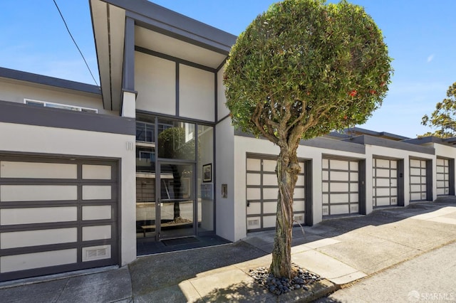 11 Perego Ter Unit 6, San Francisco, CA 94131 - view of exterior entry with stucco siding and community garages