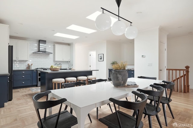 1643 43rd Ave, San Francisco, CA 94122 - dining room featuring ornamental molding and a skylight