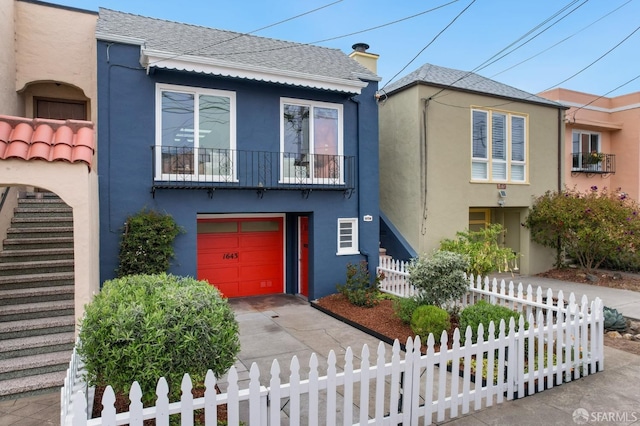 1643 43rd Ave, San Francisco, CA 94122 - view of front of home featuring stucco siding and an attached garage