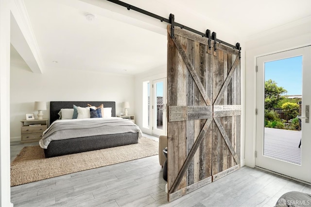1643 43rd Ave, San Francisco, CA 94122 - bedroom with a barn door, access to outside, wood finished floors, and ornamental molding
