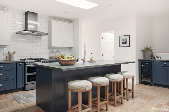 1643 43rd Ave, San Francisco, CA 94122 - kitchen featuring double oven range, wine cooler, wall chimney exhaust hood, dark countertops, and a breakfast bar