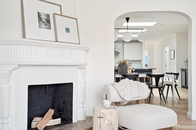 1643 43rd Ave, San Francisco, CA 94122 - living room with arched walkways and a tile fireplace