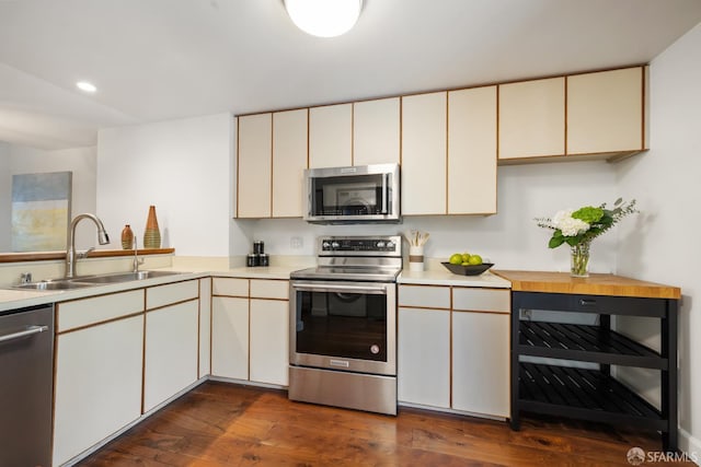 601 Van Ness Ave Unit 35, San Francisco, CA 94102 - kitchen with appliances with stainless steel finishes, light countertops, dark wood finished floors, recessed lighting, and wine cooler