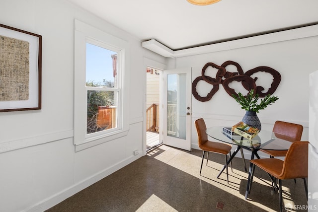 dining room featuring french doors and baseboards