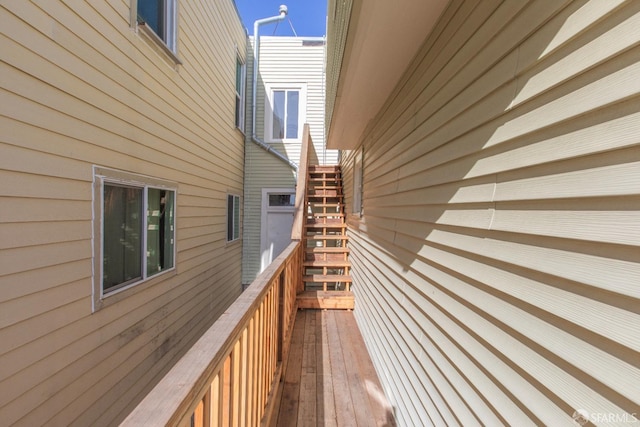 wooden deck featuring stairway