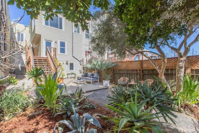 view of yard with fence, stairs, and a patio area