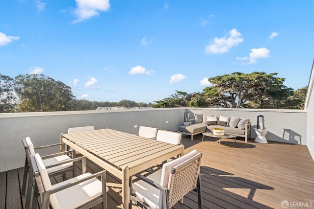 wooden deck with an outdoor hangout area
