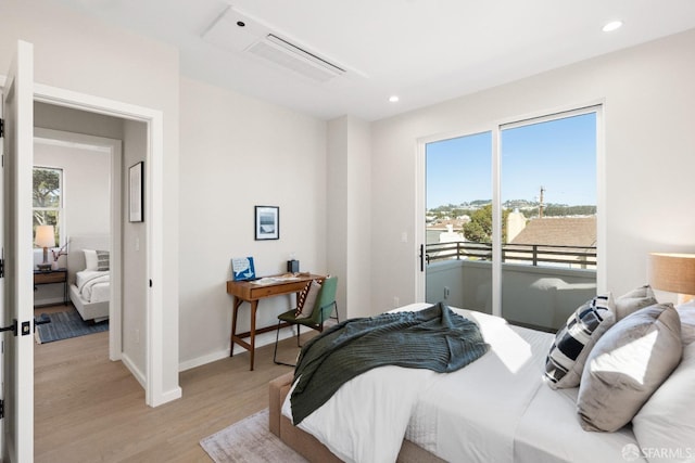bedroom featuring light wood finished floors, access to exterior, recessed lighting, and baseboards