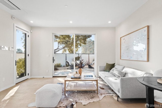 living area featuring recessed lighting