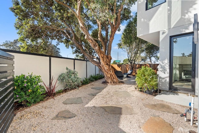 fenced backyard with a patio