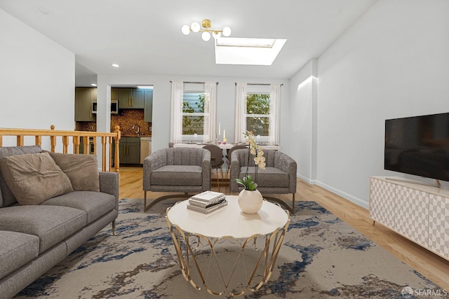3870 18th St, San Francisco, CA 94114 - living area featuring a skylight, light wood-type flooring, and baseboards