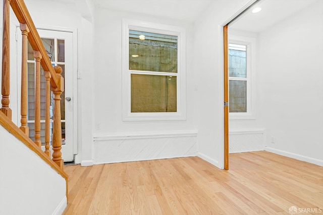 3870 18th St, San Francisco, CA 94114 - entrance foyer with light wood-style floors, stairway, and baseboards