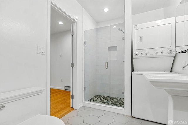 3870 18th St, San Francisco, CA 94114 - full bath featuring stacked washer / dryer, a stall shower, toilet, recessed lighting, and baseboard heating