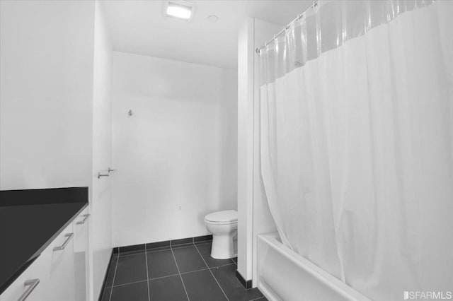 full bathroom with toilet, tile patterned flooring, vanity, and shower / tub combo with curtain