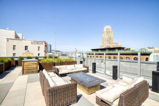 view of patio featuring an outdoor living space with a fire pit