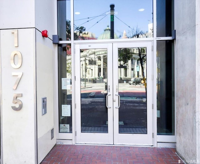 property entrance featuring french doors