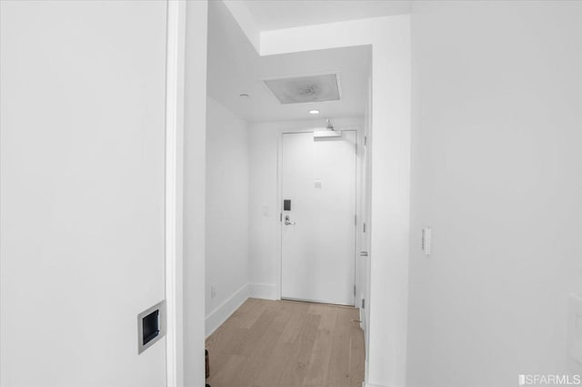 corridor featuring light hardwood / wood-style floors