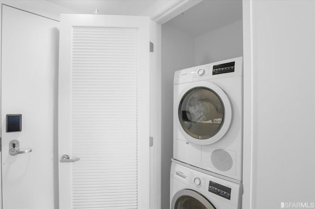 washroom with stacked washer / dryer