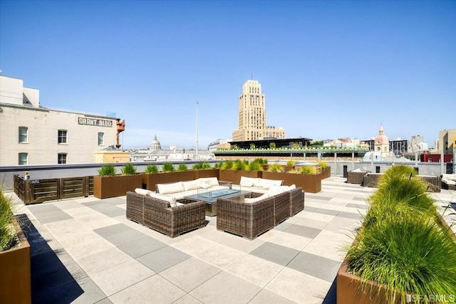 view of patio with outdoor lounge area and a water view