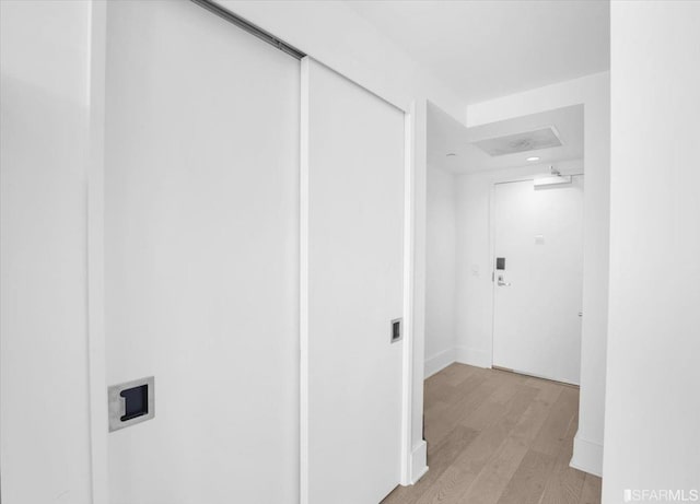 corridor featuring light hardwood / wood-style floors