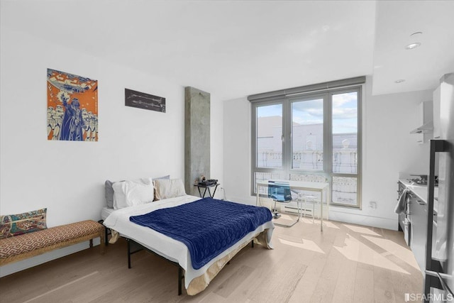 bedroom with light wood-type flooring