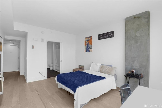 bedroom with wood-type flooring