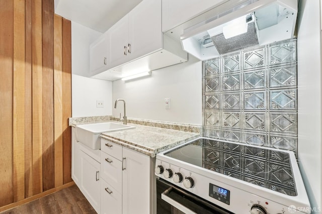 95 Ora Way Unit 303F, San Francisco, CA 94131 - kitchen featuring electric range oven, dark wood-type flooring, light stone counters, and white cabinets