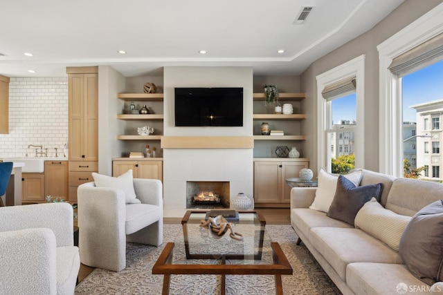 3226 Octavia St, San Francisco, CA 94123 - living room featuring a fireplace, wood finished floors, and recessed lighting
