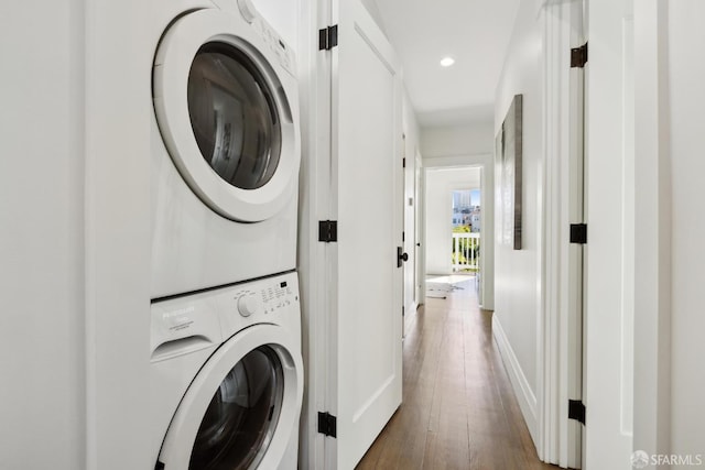 3226 Octavia St, San Francisco, CA 94123 - laundry room with stacked washer / dryer, wood finished floors, recessed lighting, and baseboards