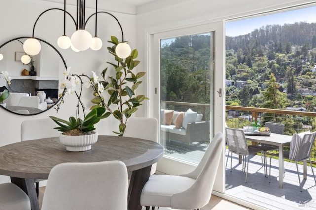 dining room with a forest view