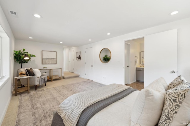 bedroom featuring light carpet, recessed lighting, visible vents, and baseboards