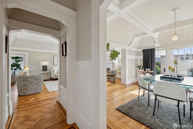 interior space featuring coffered ceiling, parquet floors, and beam ceiling