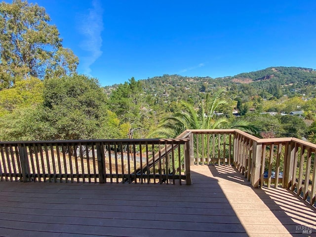 wooden terrace featuring a mountain view