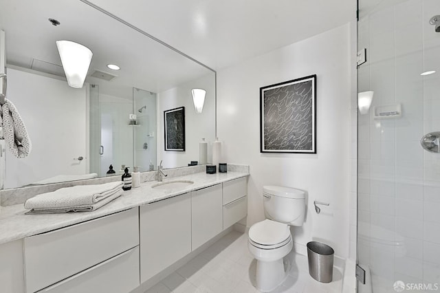 229 Brannan St Unit 12C, San Francisco, CA 94107 - bathroom with vanity, a shower stall, toilet, and tile patterned floors