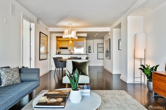 229 Brannan St Unit 12C, San Francisco, CA 94107 - living area with dark wood-style floors and baseboards
