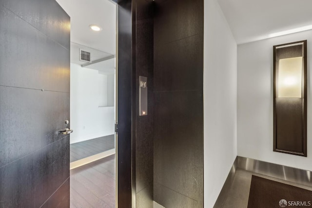 229 Brannan St Unit 12C, San Francisco, CA 94107 - bathroom with baseboards, wood finished floors, and recessed lighting