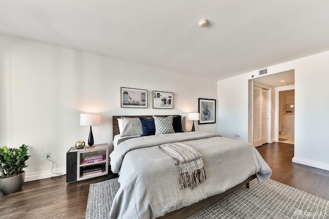 229 Brannan St Unit 12C, San Francisco, CA 94107 - bedroom featuring wood finished floors, baseboards, and ensuite bath