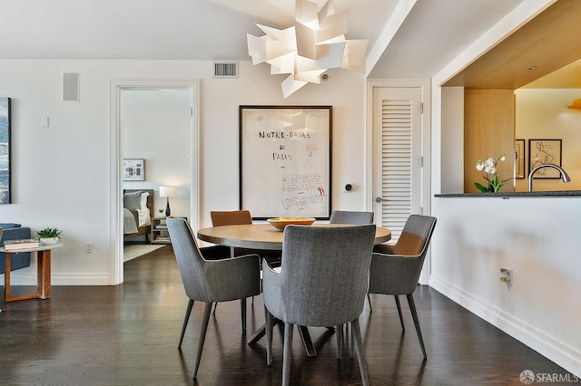 229 Brannan St Unit 12C, San Francisco, CA 94107 - dining space with dark wood-style flooring and baseboards