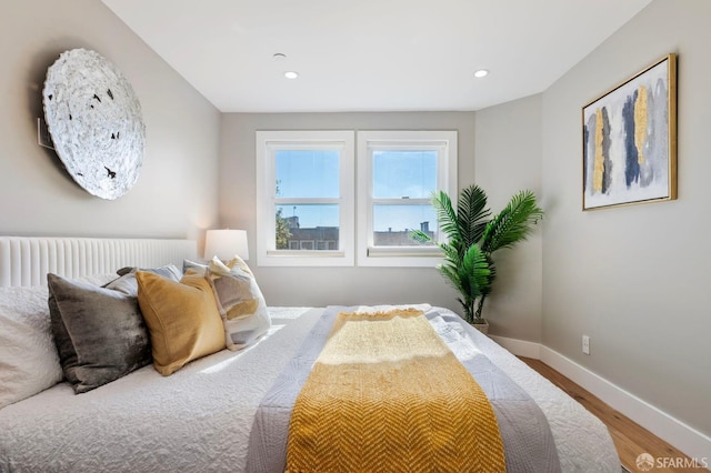 bedroom with wood-type flooring