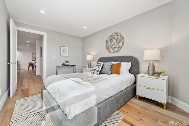 bedroom featuring light hardwood / wood-style floors