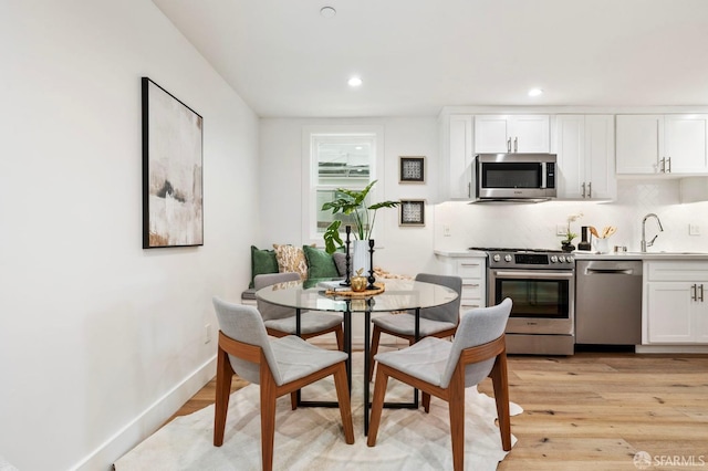 interior space featuring light hardwood / wood-style floors and sink