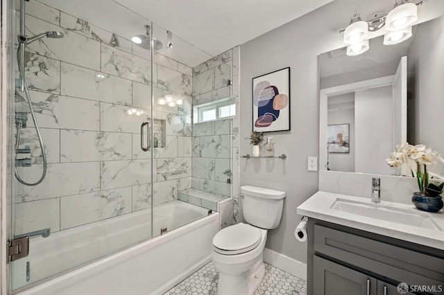 full bathroom with toilet, vanity, tile patterned floors, and shower / bath combination with glass door