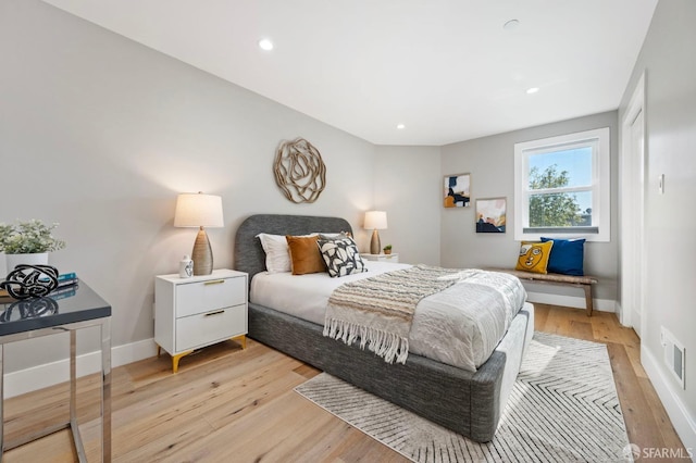 bedroom with light hardwood / wood-style flooring