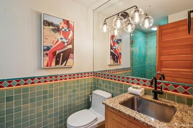 61 Homestead St, San Francisco, CA 94114 - bathroom with tile walls, vanity, toilet, and a wainscoted wall