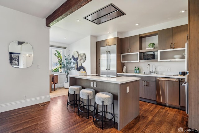 61 Homestead St, San Francisco, CA 94114 - kitchen featuring appliances with stainless steel finishes, a center island, a sink, dark wood finished floors, and beamed ceiling