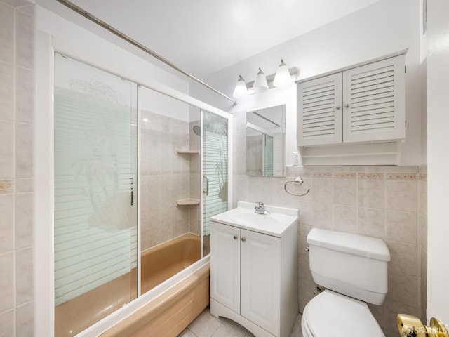1220 La Playa St Unit 105, San Francisco, CA 94122 - bathroom with combined bath / shower with glass door, vanity, tile walls, and tile patterned floors
