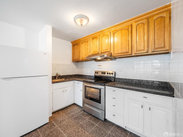 1220 La Playa St Unit 105, San Francisco, CA 94122 - kitchen with freestanding refrigerator, stainless steel range with electric cooktop, under cabinet range hood, tasteful backsplash, and white cabinetry