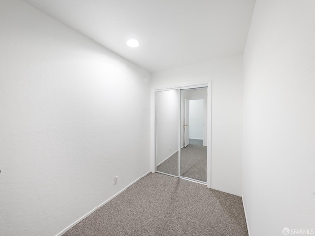 1220 La Playa St Unit 105, San Francisco, CA 94122 - unfurnished bedroom with carpet floors, a closet, and recessed lighting